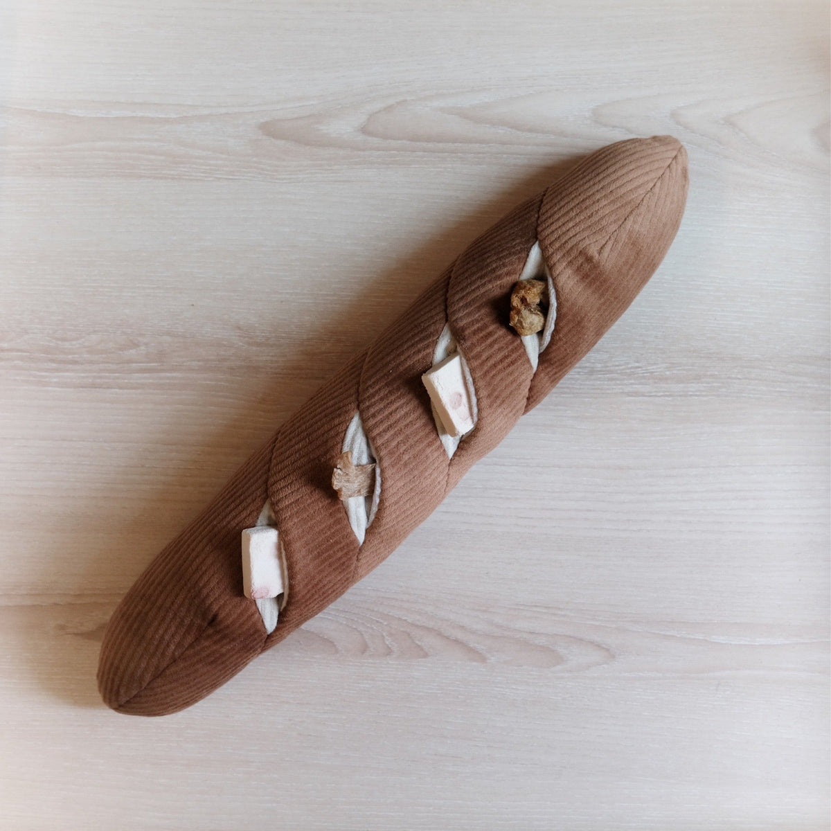 Baguette with treats in pockets